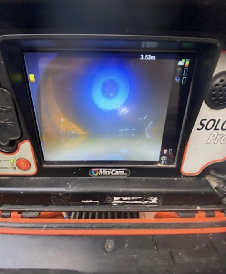 Drain inspection monitor displaying the inside of a pipe during a CCTV survey.