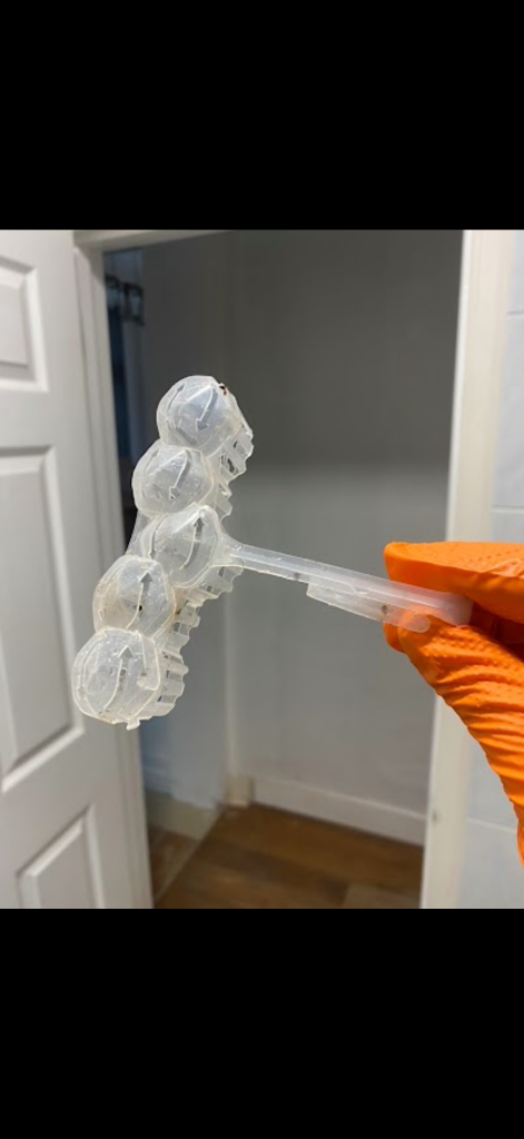 Plastic toilet freshener holder removed during blocked toilet work in Essex