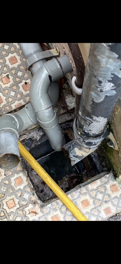 Drain access beneath external waste pipes in Milton Keynes