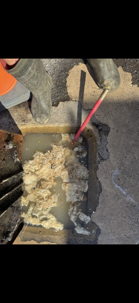 Waste and standing water inside a Milton Keynes drainage chamber